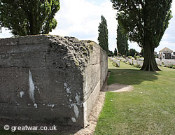 One of the numerous huge concrete German bunkers forming their strong line of defence on this ridge, left in the 
			  cemetery when it was enlarged after the war.